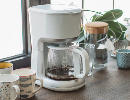 Coffee pot on brown wood counter