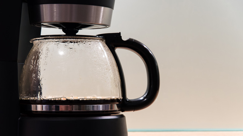 Coffee pot against grey background